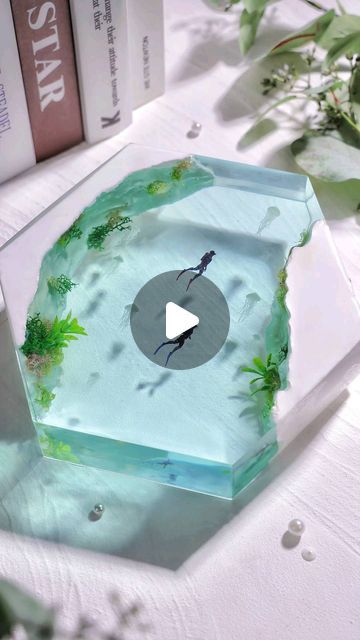 Let's Resin on Instagram: "💙 Let's explore the enchanting underwater world.  🌿 Witness the crafting process of this stunning underwater resin diorama, brought to life using our deep-pour resin kit. The underwater plants, delicately clinging to luminous rocks that radiate in the darkness, are meticulously bound together by our UV resin added with glow-in-the-dark powder. This is the key to its mesmerizing glow in the dark!  What do you think of it? Like it or love it? 😁 🔗Claim your 30% discount on our 51oz Deep Pour Resin with code: 𝟑𝟎𝐈𝐙𝟔𝟓𝐋𝐔. Link in our bio.   #letsresin #resinart #epoxyresin #resinepoxy #resincasting #dioramaart #diorama #resincreations #resindiorama #underwaterart #epoxyart #uvresincraft" Resin Underwater Scene, Deep Pour Resin, Uv Resin Crafts, Diy Uv Resin, Resin Arts, Resin Diorama, Underwater Plants, Epoxy Ideas, Underwater Art