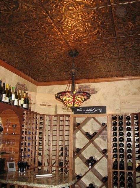 a home wine cellar spruced up with a pressed tin ceiling that gives a chic and vintage feel to the space Copper Ceilings, Copper Ceiling Tiles, Pressed Tin Ceiling, American Tin Ceiling, Wine Decor Kitchen, Tin Ceilings, Copper Ceiling, Tin Panel, Home Wine Cellars