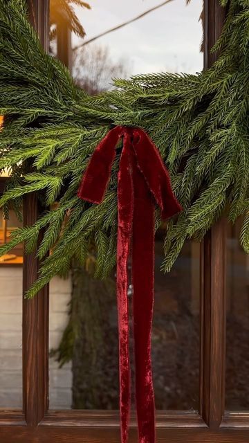 Christmas Garland Front Porch Railing, Red Modern Christmas Decor, Velvet Ribbon On Wreath, Regency Christmas Aesthetic, Cottage Christmas Aesthetic, Red Velvet Ribbon Christmas, Mckenna Barry, Christmas Hangout, Christmas Arches