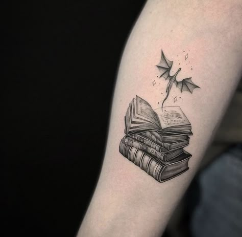 Fantasy Reading Tattoo, Tattoo Idea For Book Lovers, Book Tattoos With Dragons, Bookish Tattoos Dragon, Tattoos For Fantasy Book Lovers, Book With Dragon Tattoo, Bookish Dragon Tattoo, Realism Book Tattoo, Dragon And Book Tattoo Ideas