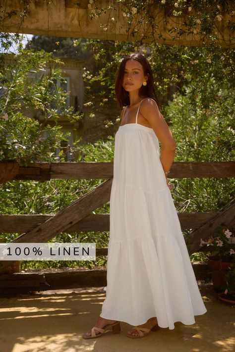 Crafted from 100% premium linen, this flowy maxi dress embodies effortless sophistication. Designed with summer in mind, its lightweight, breathable fabric ensures comfort even on the sunniest days. Featuring a flattering straight neckline with spaghetti straps. Whether you’re strolling along coastal promenades, exploring quaint market streets, or attending a seaside soirée, this dress is your ultimate companion for every summer adventure. Pair it with strappy sandals and a sun hat for daytime w Women Dresses Western, Modest Dresses Summer, Long Vacation Dress, White Beachy Dress, Beach Photo Dress, White Sundress Aesthetic, Summer Fashion 2025, Coastal Dresses, Long White Sundress