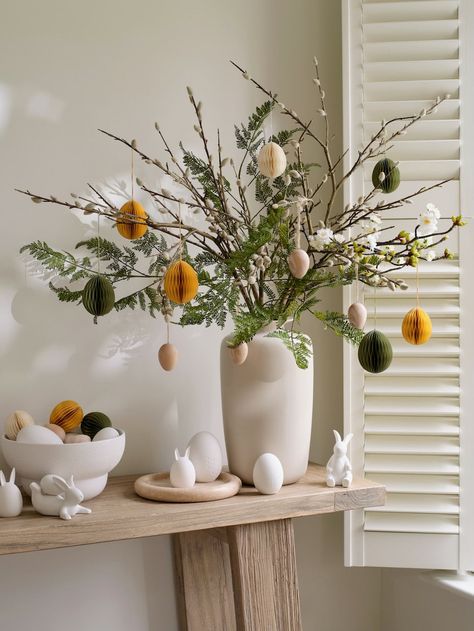 Style your table with our array of Easter decorations. From wooden eggs to faux flowers we have all you need to create this stunning Easter centrepiece. #easter #eastertable #eastertablescape #easterdecorations #easterstyling #easterdecor Easter Centrepiece, Modern Easter Decor, Easter Cocktails, Lounge Luxury, Modern Easter, Spring Table Decor, Easter Tablescapes, Hygge Decor, Wooden Eggs