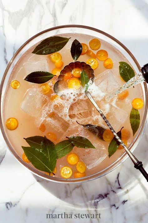 Filled with seasonal ingredients and prepared for a large crowd, we can't think of a better big-batch cocktail for New Year's Eve than this one. It's sparkling, sweet, and totally spectacular. #marthastewart #recipes #recipeideas #holidaypartyfoods #newyearfoods #cocktailpartyrecipes Cooler Recipes, Sangria Summer, Sparkling Punch, New Years Eve Drinks, Batch Cocktail Recipe, Citrus Punch, New Years Cocktails, Summer Punch, White Cranberry Juice