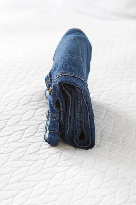 How to Do The Marie Kondo Fold for Clothing | The DIY Playbook Jeans Organization Ideas, Jeans Storage Ideas, Jeans Organization, Marie Kondo Folding, Jeans Storage, Kon Mari, Clothes Folding Board, How To Fold Jeans, Shirt Folding Board