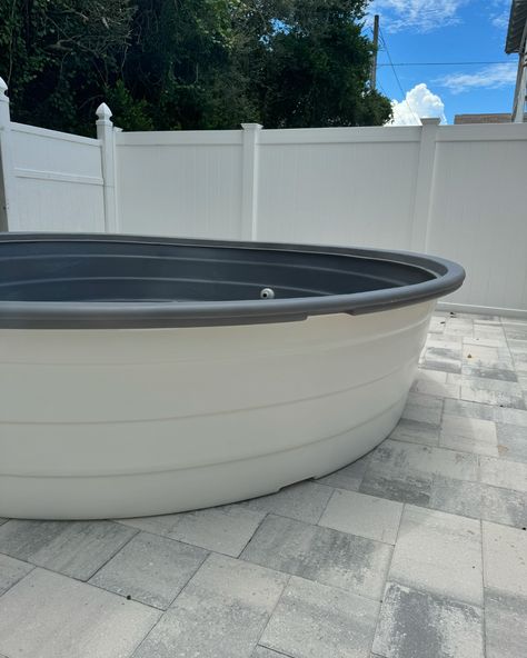 🤍 We always get asked if we can paint our poly tanks and the answer is YES! This is a 10 ft poly dry fit install we did this week for clients who are getting a deck built and we cannot wait to see the final product on this beautiful backyard! While we can paint the rim, we don’t really recommend it because it is a high traffic area. We think the grey rim with the white really pops against the pavers 😍 Are you team painted poly or leaving it it’s natural finish? 📷 10 ft poly stock tank pool... Poly Stock Tank Pool, Poly Stock Tank, Stock Pools, Pool Paint, Florida Pool, Stock Tank Pool, Tank Pool, Stock Tank, Plunge Pool