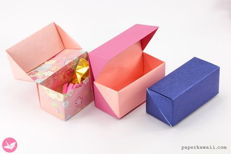 Learn how to make a beautiful hinged origami box! It's made using two sheets of paper. This origami gift box is perfect for many different kinds of presents, or store things in them. It's easy to make! No glue required. Origami Bowl, Paper Kawaii, Pill Box Organizer, Origami Gift Box, Origami Star Box, Origami Gifts, Crafts Origami, Interior Organization, Origami For Beginners