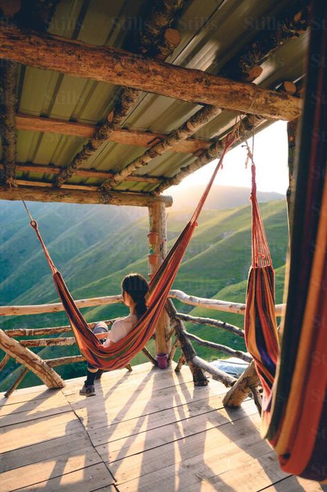 by Alex Stead | Available to license on stills.com Photo Of Woman, Breathtaking Nature, Image Reference, Bodies Of Water, Woman Sitting, Photos Of Women, Mountain Range, Hammock, Roof