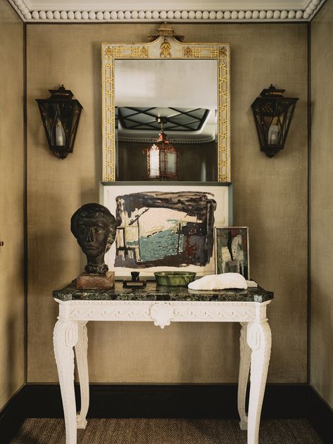 With its tented ceiling, a spare room has the feel of one of Napoleon's campaign rooms. The upholstered walls and ceiling are in Montauk Stripe, by Le Gracieux from Tissus d’Helene ; the lamp is one of a pair of unusual repousse brass column oriental lamps from Sibyl Colefax & John Fowler. A small hanging star lantern in antique brass by Charles Edwards hangs from the ceiling. The bedding is from Angela Wickstead. Mark Anthony Fox Tented Ceiling, Cottage Entry, Veere Grenney, Charles Edwards, Star Lantern, Mark Anthony, Upholstered Walls, Billiard Rooms, English Country Style