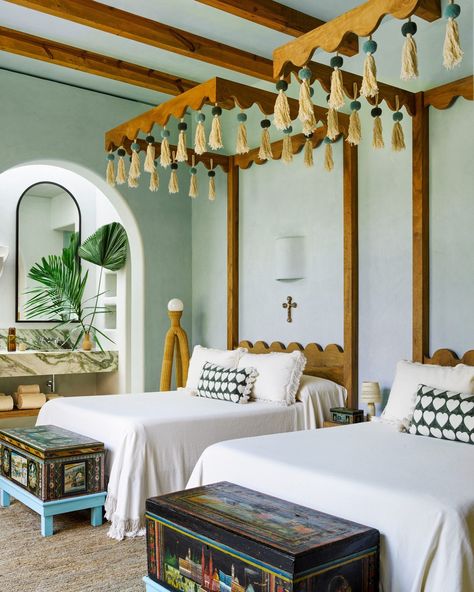 The bed frames at Summer Thornton's Casa Rosada stand as a work of themselves adorned with tassels, shell carvings, and red coral. Which room are you choosing to stay in? Get an exclusive tour of Casa Rosada (@casarosadasayulita) designed by Summer Thornton (@summerthorntondesign), at the link in our bio. — Architecture by Enrique García (@enriquegarcia_arquitectos) Landscape Design by Jorge del Real Photography by Annie Schlechter (@annieschlechter) Styling by Mieke Ten Have (@mieketenhave)... British Colonial Bedroom Decor, Luxury Bookcase, Summer Thornton, Real Photography, Tropical Bedrooms, Bed Frame Design, Hacienda Style, Canopy Design, Beach House Design