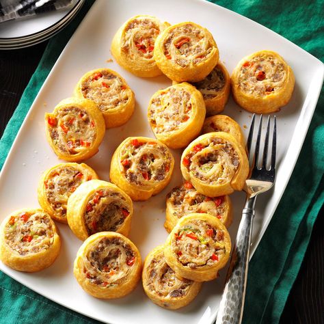 Make-Ahead Sausage Pinwheels Recipe -Filled with sausage, sweet pepper and cream cheese, these roll-ups are excellent for unexpected visitors, a cocktail party or for a halftime snack. Besides being easy to make, they can be done way ahead and kept in the freezer. All you have to do is pop them into a hot oven! —Cindy Nerat, Menominee, Michigan Sausage Pinwheels, Easy Potluck, Cream Cheese Crescent Rolls, Make Ahead Appetizers, Pinwheel Recipes, Seasoned Bread Crumbs, Quick Appetizers, Thanksgiving Appetizers, Potluck Recipes