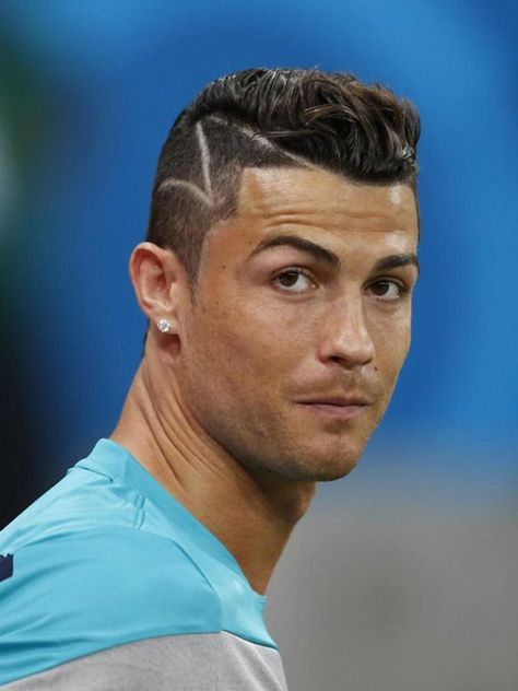 This Ronaldo-inspired haircut is a windswept undercut with a hard part. The hair on top looks like it’s eternally caught in a sudden gust of wind, while the hair on the sides is neat and tidy with a classic undercut. *** See the whole article at >>> http://haircutinspiration.com/soccer-haircuts Cr7 Haircut, Soccer Haircuts, Cr7 Lm10, Soccer Player Hairstyles, Ronaldo Hairstyle, Soccer Players Haircuts, Cristiano Ronaldo Haircut, Ronaldo Hair, Cristiano Ronaldo Hairstyle