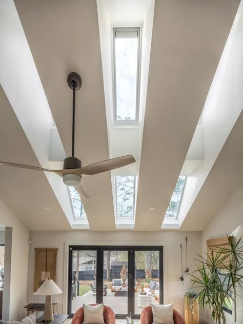 A large bank of skylights in the living room adds architectural interest and fill the space with natural light. Warm Grey, Architectural Elements, Large Windows, Design Element, Rustic Farmhouse, Smart Home, Lighting Design, Natural Light, Grey And White