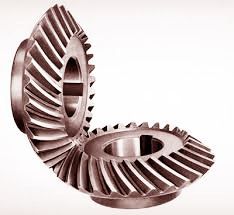 The teeth on spiral bevel gears are curved and have one concave and one convex side. They also have a spiral angle. The spiral angle of a spiral bevel gear is defined as the angle between the tooth trace and an element of the pitch cone, similar to the helix angle found in helical gear teeth. In general, the spiral angle of a spiral bevel gear is defined as the mean spiral angle. Spiral Bevel Gear, Bevel Gear, The Spiral, The Pitch, Helix