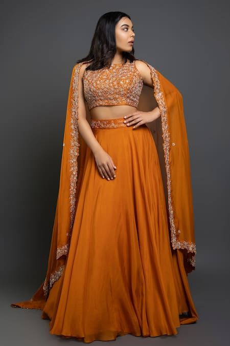 Buy Orange Raw Silk Embroidered Floral Motifs Round Flared Lehenga Set For Women by Shahmeen Husain Online at Aza Fashions. Orange Indian Outfit, Orange Skirt Outfit, Simple Lehenga Designs, Sheer Dupatta, Flared Lehenga, Orange Lehenga, Raw Silk Lehenga, Sangeet Outfit, Haldi Outfits