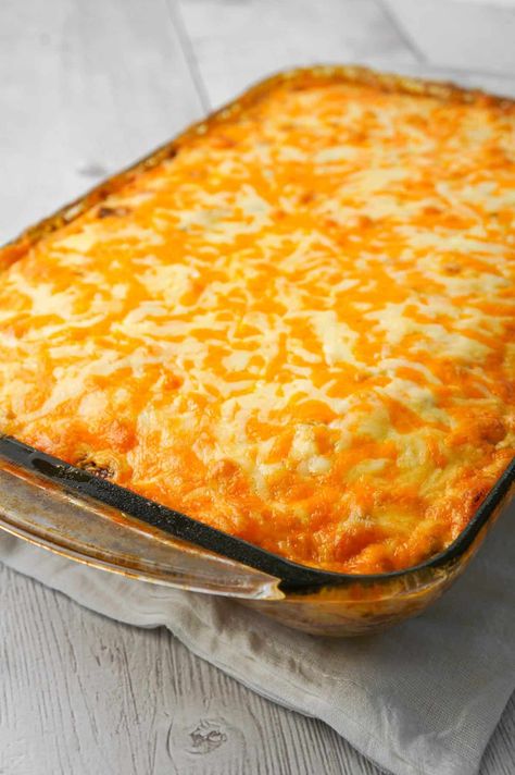 John Wayne Casserole is an easy ground beef casserole recipe with a biscuit base and loaded with diced tomatoes, corn, taco seasoning, cream cheese, mozzarella and cheddar. Hamb Meat Casseroles, John Wayne Casserole Bisquick, Mexican Street Corn Casserole, Street Corn Casserole, Mexican Corn Casserole, Mexican Cornbread Casserole Recipe, Hamburger Casseroles, John Wayne Casserole, Bisquick Biscuits