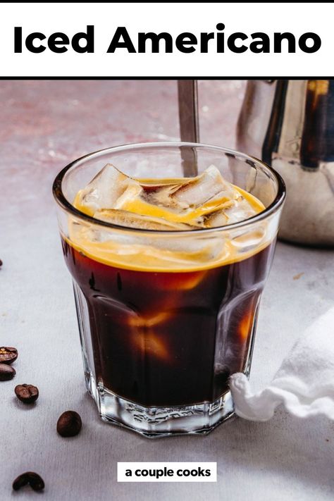 The Iced Americano is a refreshing, bold and bitter coffee drink! Here's what it is and a recipe for how to make it at home. #americano #icedamericano #coffee #coffeedink #icedcoffee #icedespresso #starbucksdrink French Press Iced Coffee, Americano Recipe, Iced Cappuccino, Iced Chai Latte, A Couple Cooks, Iced Coffee Recipe, Iced Americano, How To Make Ice Coffee, Iced Coffee Drinks