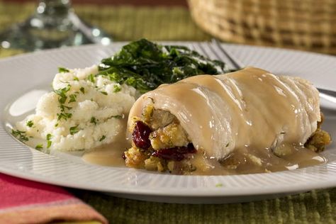 Stuffed Turkey Breast Dinner | MrFood.com Turkey Breast Cutlets, Herbed Turkey, Pot Roast Dinner, Instant Pot Roast, Turkey Cutlet Recipes, Stuffed Turkey Breast, Thanksgiving Entree, Cutlet Recipes, Turkey Roll