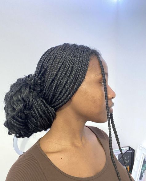 Braids Low Bun For Black Women, Box Braids In Low Bun, Low Braid Bun For Black Women, Braided Bun Aesthetic, Low Bun On Braids, Low Bun Box Braids Hairstyles, Low Bun Braids For Black Women, Low Bun Knotless Braids, Low Bun With Box Braids