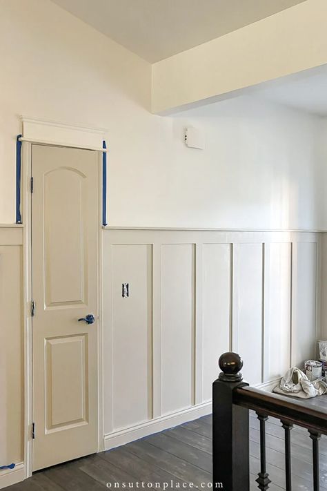 Adding board and batten walls, plus extra millwork around the doors, gives this plain foyer a much-needed update. Board And Batten Foyer, Adding Board And Batten, Board And Batten Hallway, Batten Walls, Small Foyer, Batten Wall, Board Batten, Board And Batten Wall, Kids Playroom Decor