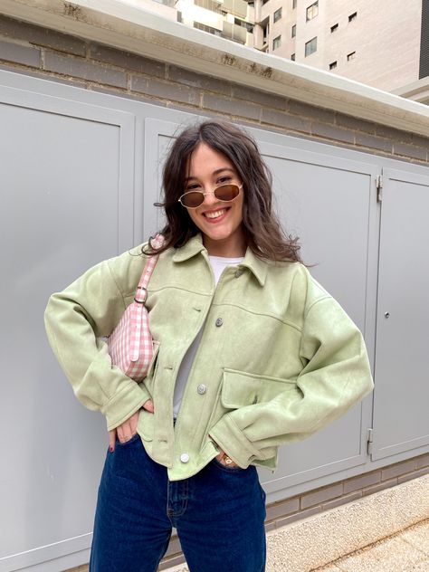 brunette girl with a green jacket, jeans, white tshirt, pink and white bag and sunglasses. Spring aesthetic look sage green aesthetic look Sage And Pink Outfit, Sage Green Jacket Outfit, Green Jacket Outfit Aesthetic, Denim Jacket Outfit Winter, Jacket Outfit Aesthetic, Pink Jeans Outfit, Black Jacket Outfit, Green Jacket Outfit, Green Hijab