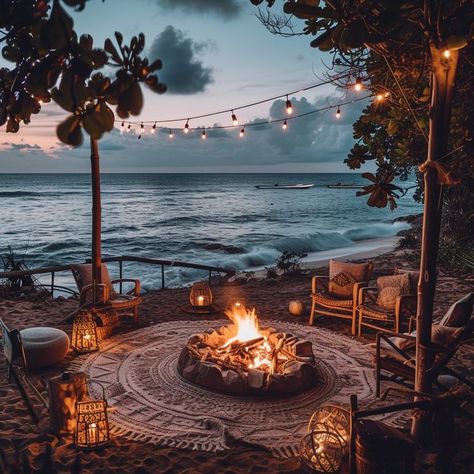 Cozy outdoor beach fire pit setup at dusk with chairs, string lights, and lanterns. Tranquil gathering space by the ocean. Fire Pit Beach, Beach Fire Pit, Beach Fire, Cozy Outdoor, Comfortable Chair, String Lights, Soundtrack, Fire Pit, Lanterns