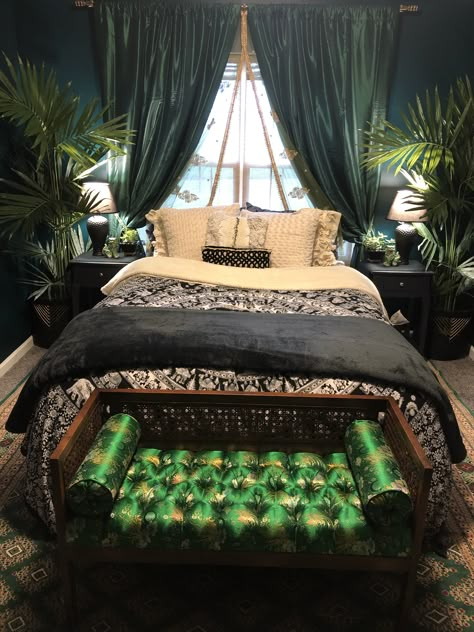 This bedroom was inspired by the lush emerald green color palette. 💚The walls are painted “Sherwood Forest” by Benjamin Moore paints. The emerald green curtains and faux large palm plants flanking the bed are from Overstock. The hand knotted Turkish rug from Etsy. The bench at the end of the bed is an antique store find, we got it for $100 and I found the beautiful green oriental fabric on Etsy, and was able to have it reupholstered. Message me with any questions, I’m happy to answer them! 💚 Emerald Green Boho Decor, Emerald Green Gothic Bedroom, Bedroom Wall Curtains, Lush Green Bedroom, Forest Green Bedroom Curtains, Emerald Glade Bedroom, Navy Emerald Bedroom, Viridian Green Bedroom, Emerald Green Wall Paint Bedroom