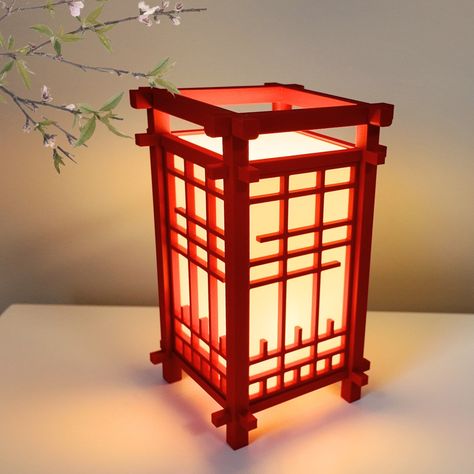 Product Name:  3D-Printed Japanese Lantern Shoji Style Desk Lamp Product Description: Envelop your workspace in a serene ambiance with our meticulously crafted 3D Printed Japanese Lantern Desk Lamp in Shoji Style. Inspired by the elegance of traditional Japanese shoji screens, this exquisitely designed lamp seamlessly blends cultural heritage with modern functionality, providing both illumination and an artistic essence to your desk or table. Included: -3D Printed Japanese Lantern Shoji Style Desk Lamp -E12 Base, E12 LED Light Bulb Included (3000K Soft Warm White) -US Cord with Rotary On/Off Switch Product Dimensions: Width: 4.05 inches Height: 6.75 inches Available Colors: Crimson Red Midnight Navy Olive Green Jet Black Ivory White Ash Grey Product Material: 3D Printed in PLA (Polylactic Japanese Wooden Lamp, Red Japanese Lanterns, Chinese Decorations Ideas, Japanese Light Fixtures, Japanese Theme Bedroom, Japanese Inspired Decor, Room Ideas Japanese Style, Japanese Lamps Traditional, Japanese Lanterns Diy