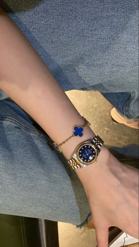 gold rolex and gold van cleef and arpels blue bracelet with blue jeans Van Cleef Arpels Bracelet Blue, Blue Rolex Women, Blue Watches Women, Blue Van Cleef Bracelet, Blue Accessories Aesthetic, Blue Jewelry Aesthetic, Van Cleef Bracelet Stack, Blue Van Cleef, Van Cleef Watch