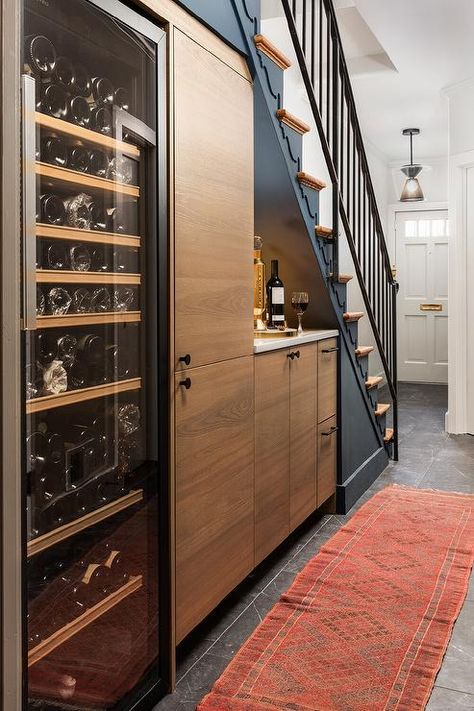 Hidden Wine Cellar, Bar With Wine Cooler, Under Staircase Storage, Tall Wine Fridge, Wine Fridge Cabinet, Bar Under Stairs, Under Staircase, Under Stairs Wine Cellar, تحت الدرج