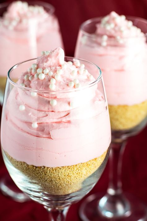 Single serve cheesecake parfaits with a hint of pink lemonade flavor on a bed of crumbled graham crackers. They're the perfect party treat for all seasons! Pink Lemonade Cheesecake, Lemonade Cheesecake, Pink Lemonade Cake, Pink Lemonade Recipes, Pink Lemonade Party, Cheesecake Parfaits, Coconut Dessert, Pink Desserts, Lemonade Party