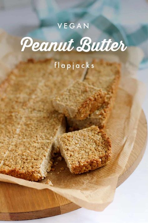 Easy 5 ingredient peanut butter flapjacks made and baked in under 30 minutes. These vegan flapjacks are salty-sweet thanks to the peanut butter and crunchy demerara sugar, syrupy, and oh so moreish. Perfect for after-school snacks, lunchboxes, as well as grab and go breakfasts. Peanut Butter Flapjack, Batch Cooking Recipes, Demerara Sugar, Ice Cream For Breakfast, Quick Baking, Fudgy Brownie Recipe, Freezable Meals, Healthy Freezer Meals, Peanut Butter Roll