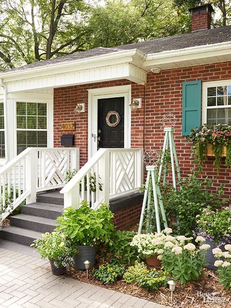 Before the season turns, get a start on boosting your curb appeal. Get inspiration from this done in a weekend DIY front porch remodel. Painted shutters, added flower boxes, a DIY wreath and colorful decor added a welcoming feel to the front of this charming house. Front Porch Remodel, Diy Exterior, Diy Curb Appeal, Painting Shutters, Home Improvement Outdoor, Porch Remodel, Building A Porch, Brick Ranch, Diy Front Porch