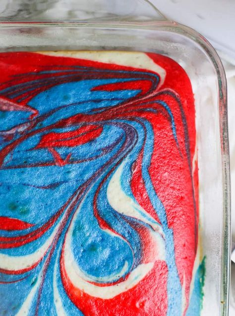 Retro Red White and Blue Explosion Cake - The vibrant colors literally explode with the red, white and blue tie dye effect, marbled in a light and fluffy vanilla white cake.  It's topped with a super creamy, vanilla buttercream frosting and pretty patriotic sprinkles and stars. It tastes really yummy, baked in a 9x13 pan and is perfect for the 4th of July.  #red white and blue #4th of july #cake #dessert #holidays #vanilla #sprinkles Red White And Blue Cheesecake, Blue Cheesecake, Blue Explosion, Red White And Blue Tie Dye, Explosion Cake, Flag Cake, Patriotic Desserts, Blue Desserts, 4th Of July Desserts