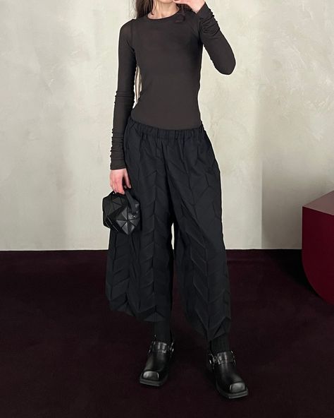 The Me Issey Miyake black Zig-Zag pleats pants, styled with the Rick Owens dark dust classic rib long sleeve, the Bao Bao Cuboid shoulder bag and the Acne Studios leather buckle mule. ⁠ ⁠ New Arrivals from Me Issey Miyake are available in-store now and will be online soon. Issey Miyake Pants, Pleats Pants, The Rick, Bao Bao, Leather Buckle, Issey Miyake, Rick Owens, Zig Zag, Mule