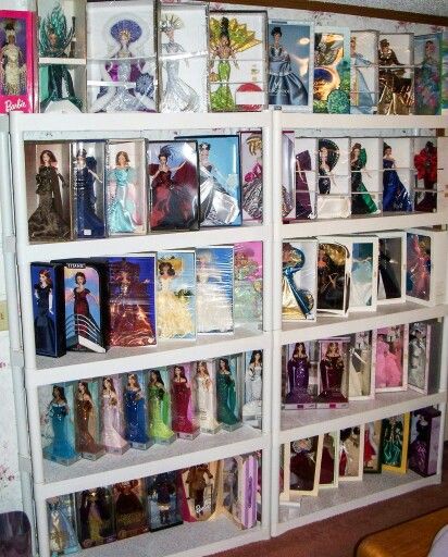 Karen Holshouser's collection Barbie Display Ideas Shelves, Barbie Collection Display Ideas, Barbie Shelves, Barbie Collection Display, Barbie Display Ideas, Barbie Doll Display, Barbie Stand, Doll Display Ideas, Toy Collection Room