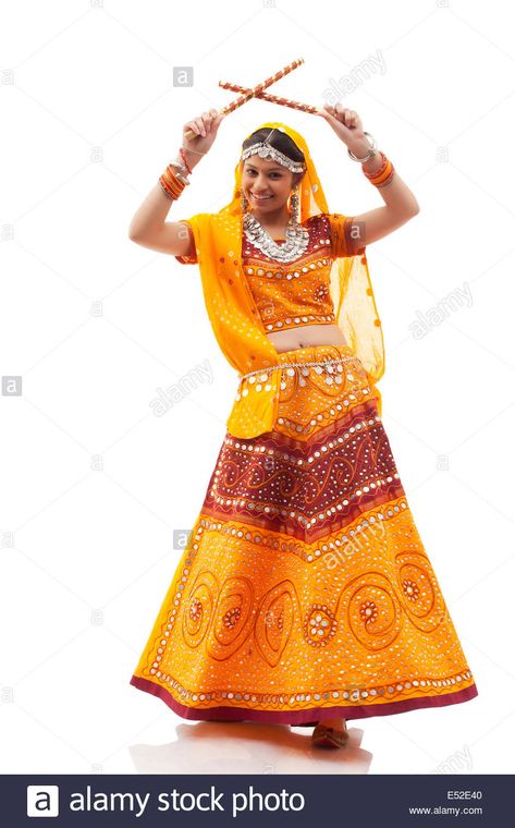 Full length portrait of happy young woman playing Dandiya Raas isolated over white background Stock Photo Dandiya Raas, Indian Classical Dance, Classical Dance, Young Woman, White Background, Full Length, Resolution, Stock Photos, White