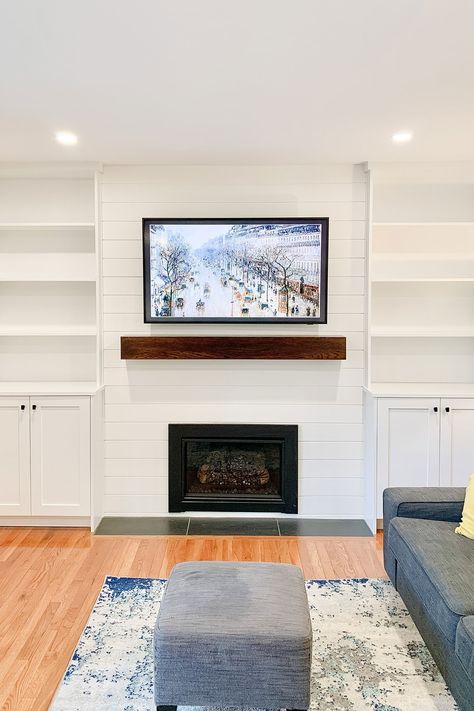 Sneak peak: A new gas fireplace insert, shiplap, mantle and custom built-ins create a stunning focal point in this cozy family room. Fireplace Built Ins Uneven, Built Out Shelves Living Room Fireplace, Built In Shelves Living Room Gas Fireplace, Living Room Designs With Gas Fireplace, Gas Fireplace Tv Wall Built Ins, Gas Fireplace Built Ins With Tv, Gas Fireplace With Built Ins On Both Sides, Built In Gas Fireplace And Tv, Adding A Gas Fireplace To Living Room