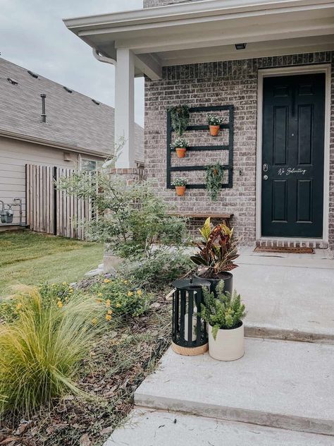 small suburban front porch with a plant wall Brick Wall Decor, Front Porch Plants, Porch Wall Decor, Painted Brick Walls, Porch Plants, Wall Clips, Plant Clips, Diy Front Porch, Hanging Plant Wall