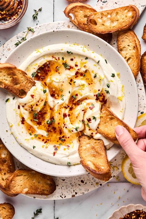 This whipped ricotta cheese is an easy appetizer that takes only a few minutes to make. The whipped ricotta dip is topped with hot honey Ricotta Cheese With Honey, Ricotta Cheese Bowl, Whipped Cheese Appetizer, Hot Honey Ricotta Dip, Whipped Ricotta Hot Honey, Ricotta Cheese Appetizers, Appetizers With Ricotta Cheese, Whipped Ricotta Dip Honey, Whipped Riccota