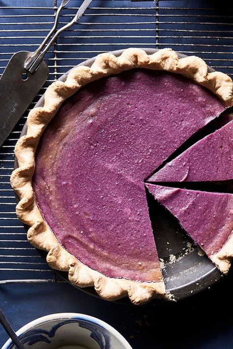 This purple version of classic sweet potato pie has a shot of brandy, which adds another layer of seasonal flavor. Serve with a dollop of lightly sweetened whipped cream. #holidays #holidayrecipes #recipe #eatingwell #healthy Pie With Pecan Crust, Purple Pie, Vegan Sweet Potato Pie, Pecan Crust, Sweet Potato Pies Recipes, Purple Sweet Potato, Purple Potatoes, Purple Sweet Potatoes, Vegan Sweet Potato