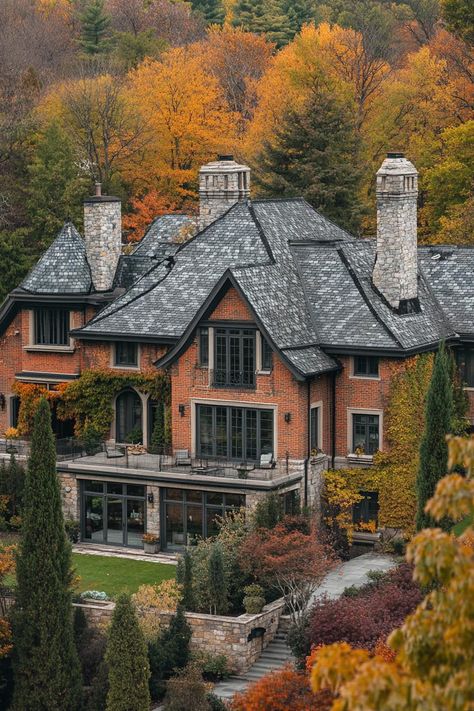 High angle view of large manor house with brick siding modern windows roof with gables and grey stone shingles chimney vines on facade front. Roam the grand halls of manor houses, where century-old secrets meet architectural splendor, offering you a taste of noble living without the need to perfect your curtsy. Tudor Revival Style Homes, Modern Manor Exterior, Jerkinhead Roof, Manor Exterior, Old Brick House, Brick Siding, Stone Chimney, Unusual Buildings, Tudor Style Homes