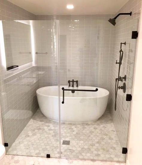 Walk-in shower with tub inside and bronze hardware Master Shower And Tub, Tub In Shower Combo, Shower And Tub Walk In, Shower In Tub Ideas, Soaking Tub In Shower Walk In, Walk In Tub Shower Combo Master Bath, Bathroom Tubs And Showers, Shower And Tub Together, Tub Shower Enclosure Ideas