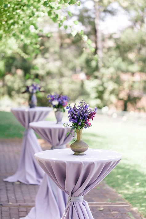 #cocktail-table  Photography: We Heart Photography - www.weheartphotography.com  Read More: http://www.stylemepretty.com/2014/11/21/bright-magenta-vineyard-wedding/ Wedding Cocktail Hour Florals, Bride And Groom Table Purple, Lavendar Table Settings, Lavender Table Setting Wedding, Lavender Sweetheart Table, Purple Garden Party, Purple Table Settings, Wedding Cocktail Tables, Purple Wedding Tables