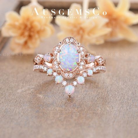 🌸One of a Kind - No Opal is the same, get your unique fine jewelry from AUSGEMSCo. **All rings are handmade and shipped in Australia.  Opal Engagement Ring Set Antique Rose Gold Oval Opal Bridal Set Vintage Art Deco Milgrain Moissanite Ring Cluster Women Vine Leaf Flower Check the Engagement Ring only: https://www.etsy.com/listing/1337108581 ITEM Details Main Stone: Lab Opal, 5*7mm, Oval Cut Accent Stone: Moissanite, 0.09 ct total, G color, VS Clarity, Natural Opal, 1.8mm, Round Cut Ring Band: 1.6mm  Wedding Band: Main Stone: Lab Opal, 2.5mm, 2mm, 1.6mm, Round Cut, Moissanite, 0.108 ct total, G color, VS Clarity Ring Band: 1.2mm Metal Choice: 10K/14K/18K Solid Gold or Pt (Rose, White, or Yellow)   Please note, the matching jewelry shown in the listing can be purchased separately. But AUSG Abnormal Wedding Rings, Vintage Opal Engagement Ring Art Deco, Non Traditional Wedding Rings Sets, Luxury Opal Wedding Ring With Gemstone Accents, Luxury Gold Opal Ring Art Deco Style, Opal Wedding Ring With Intricate Design, Rose Gold Opal Engagement Ring Set, Gold Opal Ring With Halo Design, Oval Shape, Oval Opal Ring