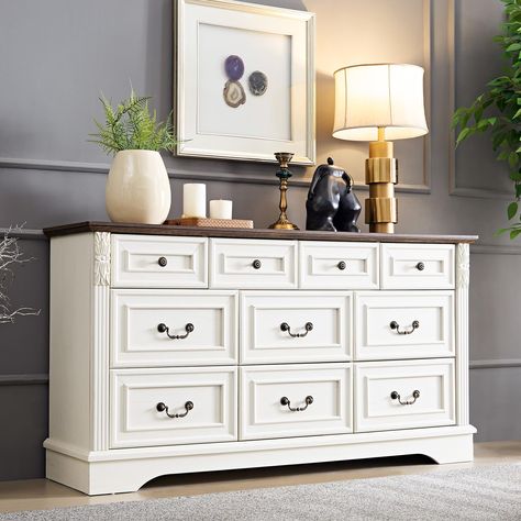 PRICES MAY VARY. 【Exquisite Crafted】Assembled dimension: 59"W x 16"D x 32"H.Showcasing traditional elements like carved pilasters, bracket feet, and framed drawer fronts, it’s sure to add an elegant touch to your master suite. 【Spacious and Stylish】This beautifully designed dresser offers ample storage space with 6 large drawers and 4 generously sized drawers, perfect for organizing your clothes, linens, and other essentials in any room. Its metal drawer pulls feature an antique brass hue to com Beige Vintage Dresser, Bedroom Chest Of Drawers Decor, Antique White Dresser, Dresser Remodel, Chest Of Drawers Decor, Decorating With Antique Furniture, Dressers Bedroom, Rustic Chest Of Drawers, Dressers For Bedroom