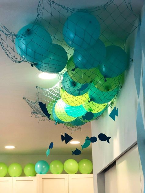 Fish netting
Ocean party
Shark party
Fish decorations
Balloons
Craft fish Ocean Themed Room Decorations, Fish Birthday Party Decorations, Aquatic Decorations Party, Diy Shark Decorations, Diy Sea Turtle Party Decorations, Under The Sea Party Ideas Decoration, Ocean Theme Event, Aquatic Theme Birthday Party, Diy Bubble Decor