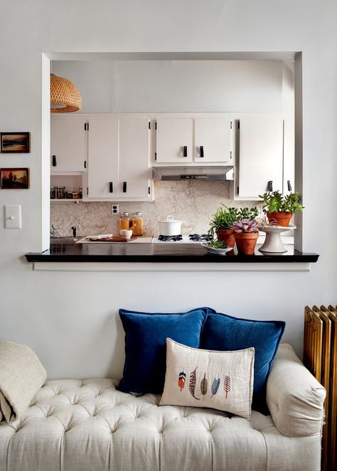 Our Small Feathers Pillow sits nicely in Amy Azzarito's beautiful apartment featured in The New York Times Great Homes and Destinations! Take a look - NYTimes.com To Purchase: https://www.coralandtusk.com/catalog/product/view/id/3891/s/small-feathers-pillow/ Window Connecting Kitchen And Living Room, Kitchen Cutout To Living Room, Undining Room Ideas, Wall Between Kitchen And Living Room, Sf Apartment, Living Room Remodel, Farmhouse Style Kitchen, Modern Farmhouse Kitchens, Ikea Kitchen