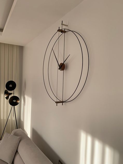 Statement Wall Clock, Wall Watch Design, Wall Clock Decor Ideas, Wall Clock Decor Living Room, Wall Watches, Clock Decor Ideas, Silver Wall Clock, Watch Wall, Clock Design Ideas