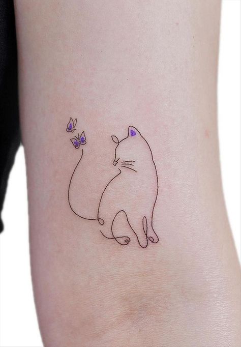 A minimalist cat tattoo can be a charming and subtle way to express your love for felines. Consider a simple outline of a cat's silhouette, perhaps with clean lines and minimal detail. You could opt for a small design on your wrist, ankle, or behind the ear for a discreet yet stylish look. Black ink tends to work well for minimalist tattoos, but you could also explore other subtle colors if you prefer. Just ensure you find a talented tattoo artist who specializes in minimalist designs Cute Cat Tattoo Ideas, Tattoo Ideas 2022, Jinx Tattoo, Cat Lover Tattoo, Minimalist Cat Tattoo, Cat Tattoo Ideas, Tato Tradisional, Cat Tattoo Simple, Cute Cat Tattoo