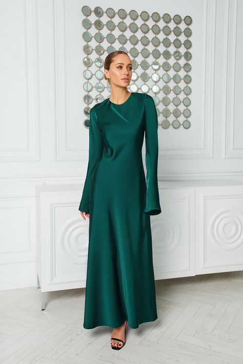 Embrace regal elegance in our Alexa Emerald Satin Maxi Dress. Crafted from luxurious satin fabric, this dress exudes sophistication and charm. The long sleeves add a touch of modesty, while the flowing maxi length creates a stunning silhouette. The rich emerald hue is perfect for making a statement at formal events or special occasions.   #dress #dresses #maxidress #emeralddress #satindress #longsleeve #eveningdress #weddingdress Modest Satin Dress, Long Sleeve Satin Dress, Satin Dresses Long Sleeve, Modest Maxi Dress, Elegant Outfits, Wear Store, Satin Long Sleeve, Maxi Dress Sale, Silk Maxi Dress